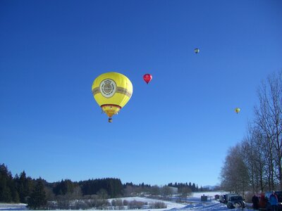 Hot air balloon ride winter snow