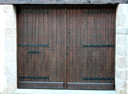 Antique doors big brown doors studded wooden door photo