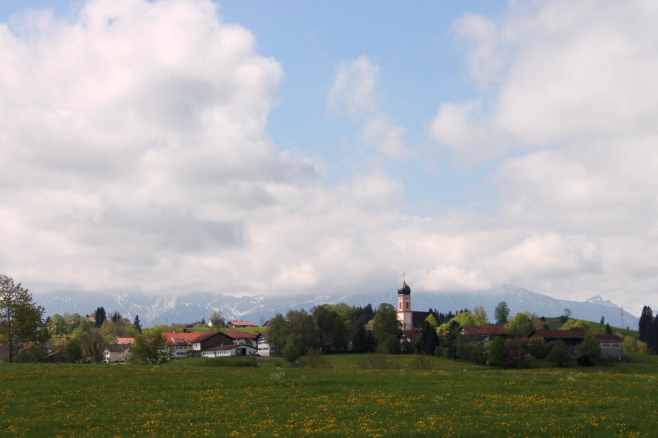 Alpine panorama in the spring village church spring