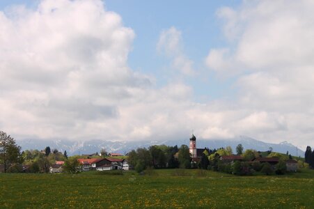 Alpine panorama in the spring village church spring photo
