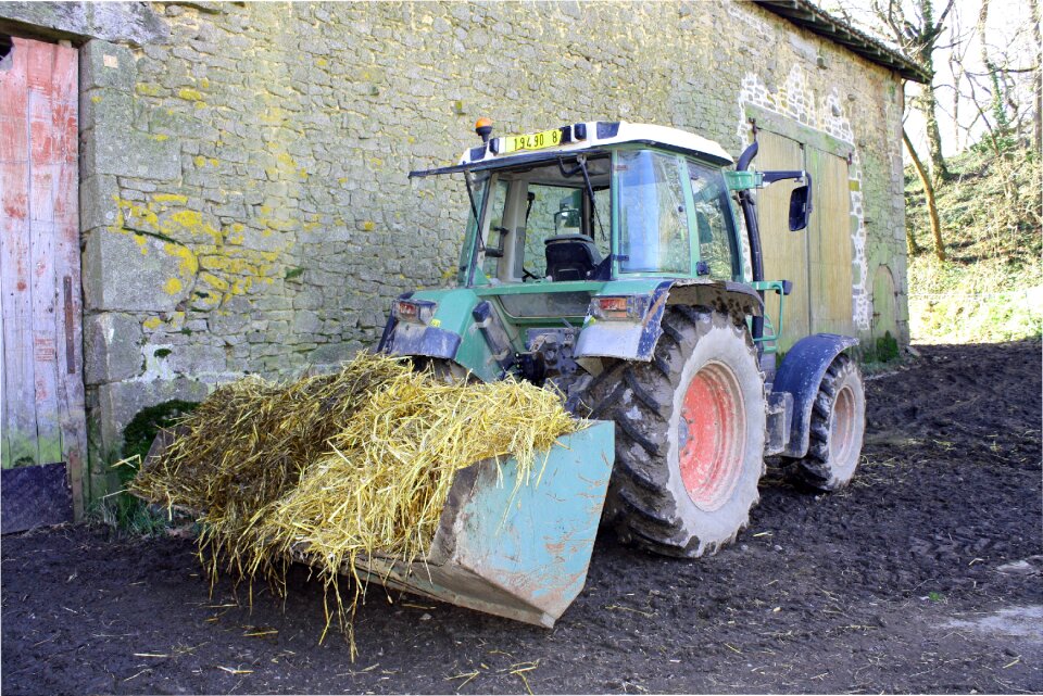 Working tractor loaded tractor green tractor