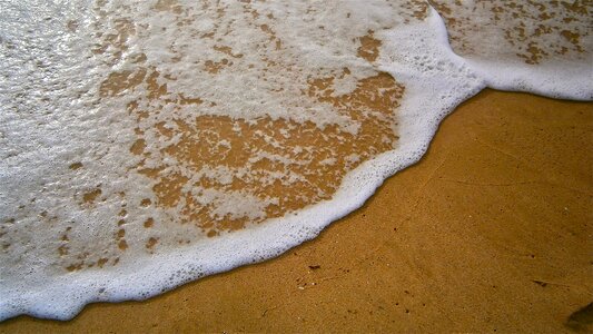 Wave sand water photo
