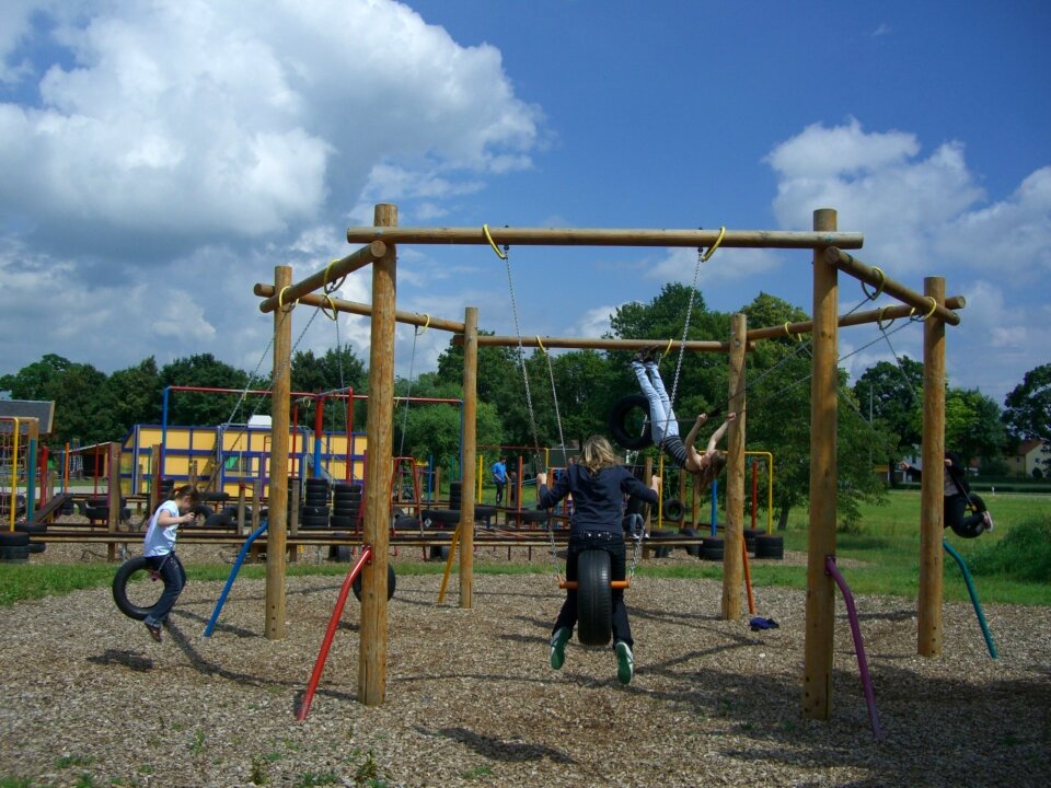 Tire swing sky blue clouds