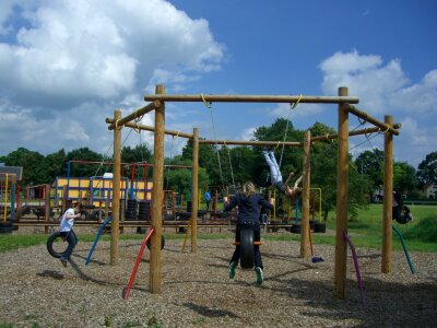 Tire swing sky blue clouds