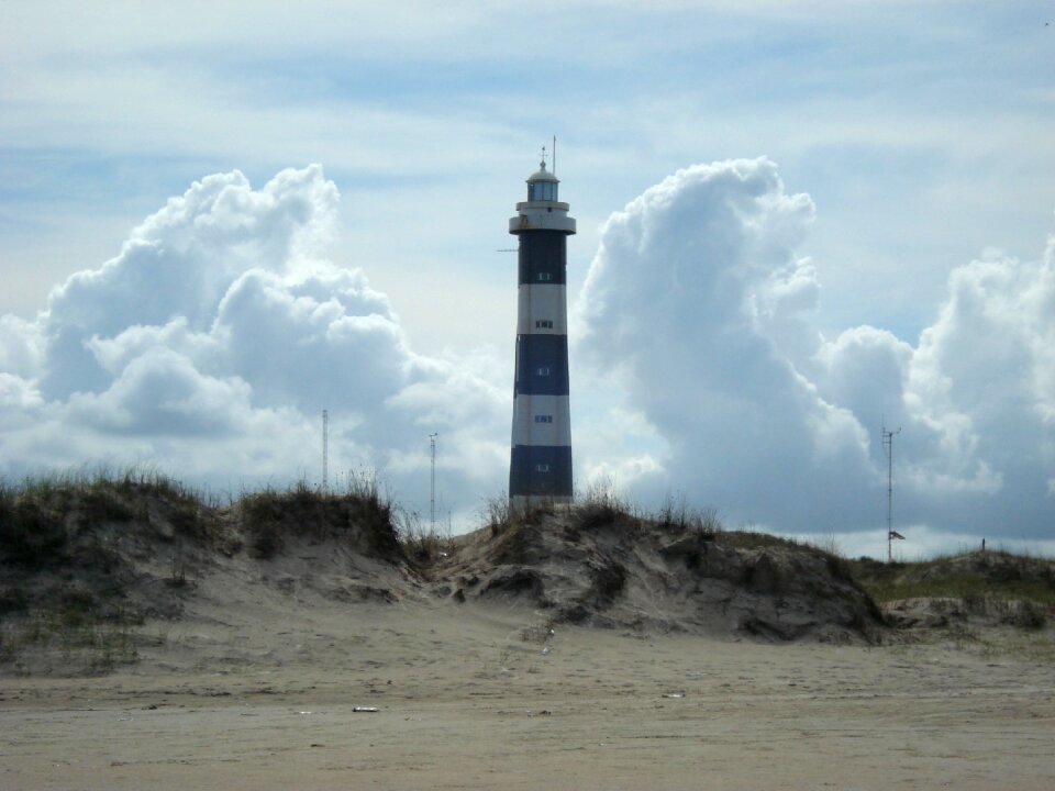 Lighthouse loneliness beach cloud