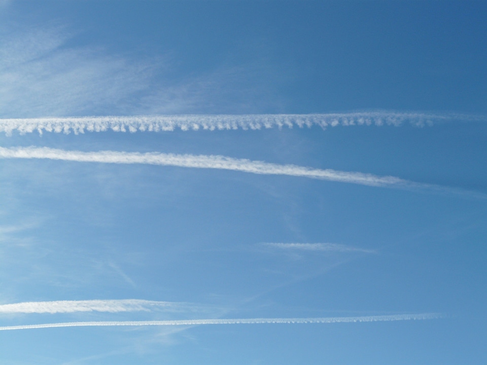 Blue flying aircraft