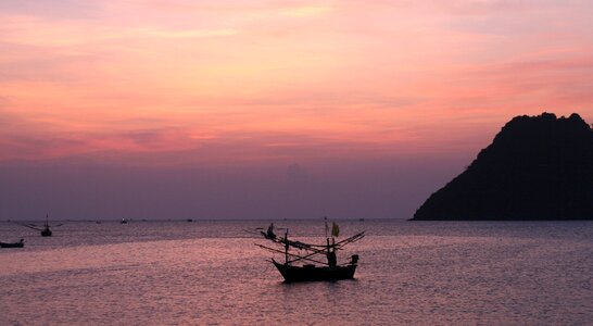 Solitary sunrise boat photo