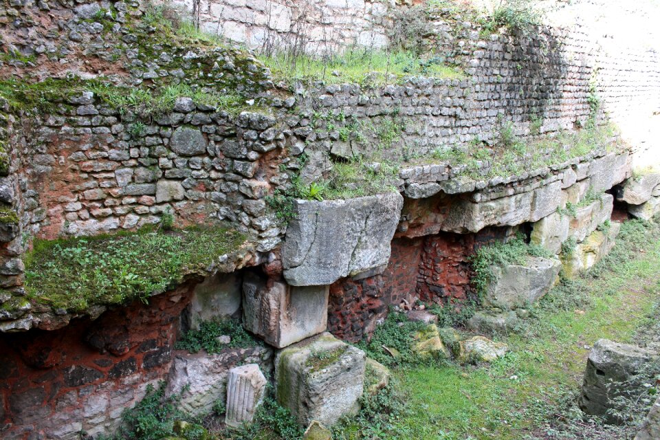 Churchyard excavations red brick broken pillars