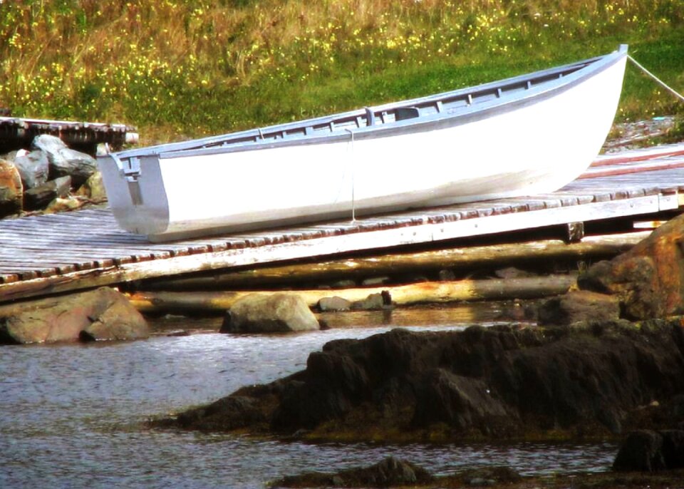 Row boat ocean wharf