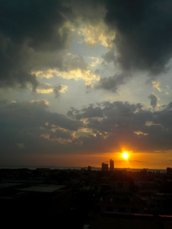 Sunset dark clouds sun