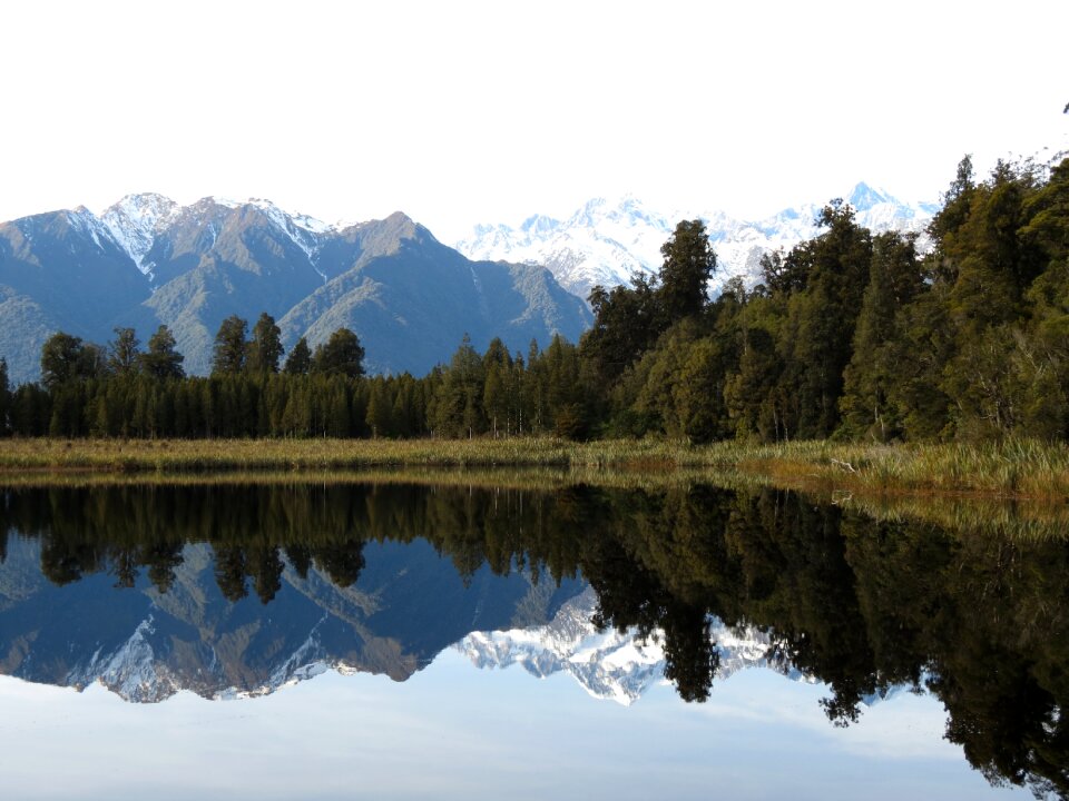 Alpine lake snow photo