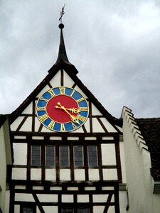 Time indicating clock face facade photo