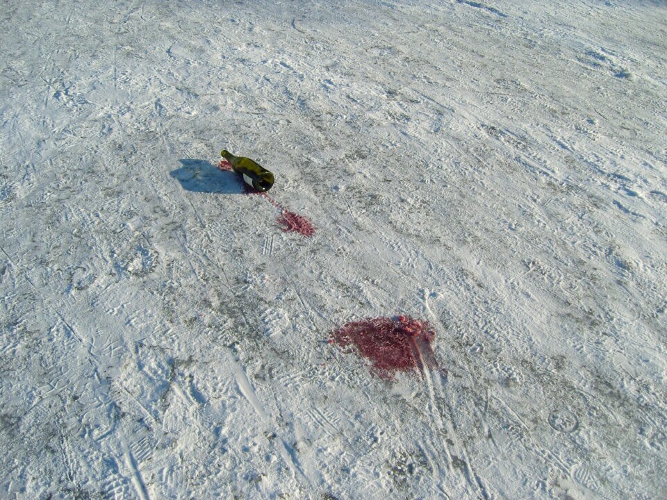 Red wine tracks in the snow alcohol