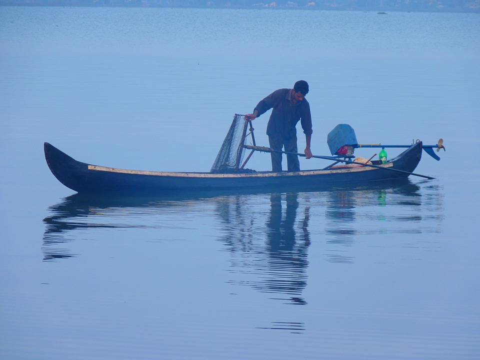 Fish catch fish man photo