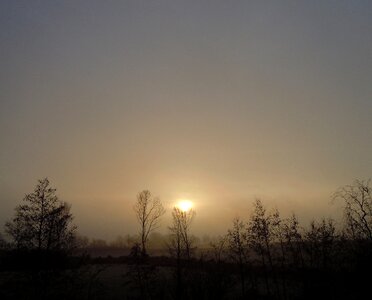 Morning haze backlighting sunrise photo