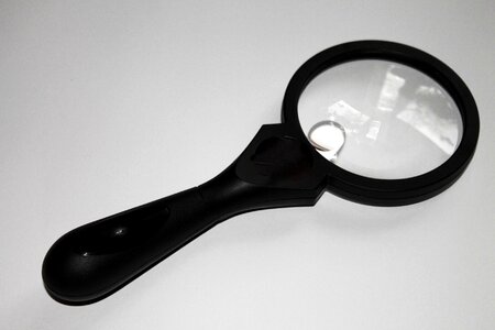 Magnifier glass to watch search photo