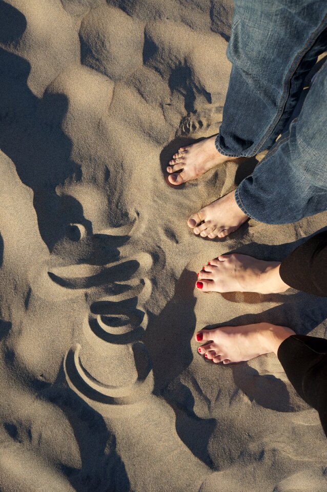Man woman sand