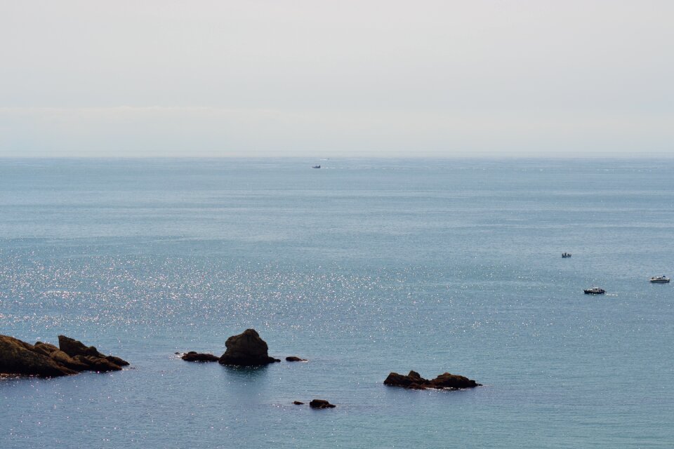 Afternoon haze boats calm water