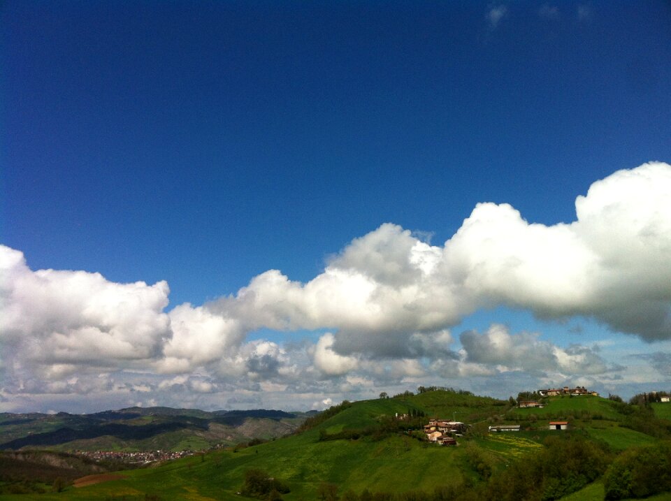 Landscape hill low flying clouds photo