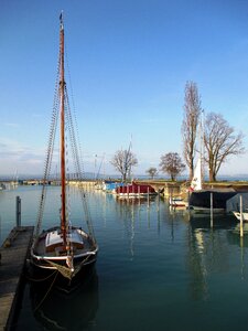 Beautiful wooden mast boat harbour photo