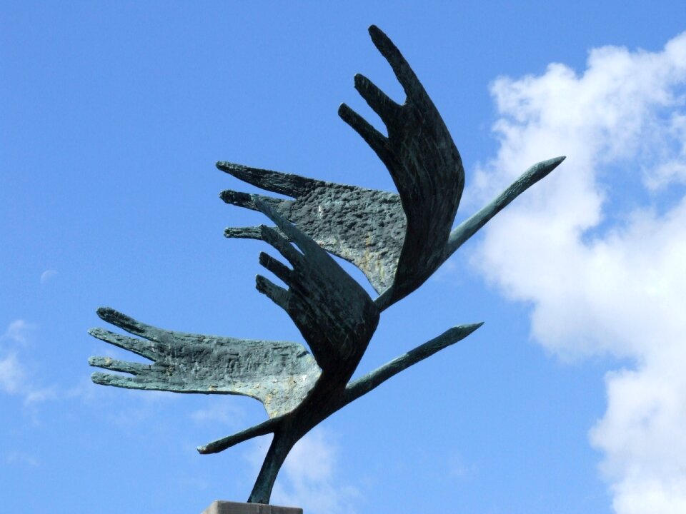 Figure sculpture sky