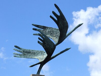 Figure sculpture sky