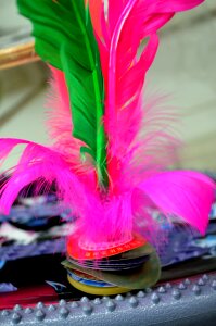 Weighted shuttlecock feathers
