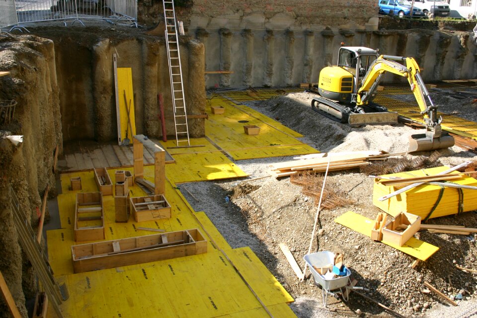 Yellow excavators build