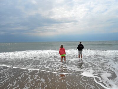 Kids ocean beach walk photo