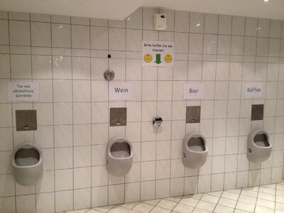Porcelain urinals men's room photo