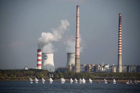 Sails lake chimneys with smoke