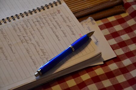 Writing down handbook notebooks photo