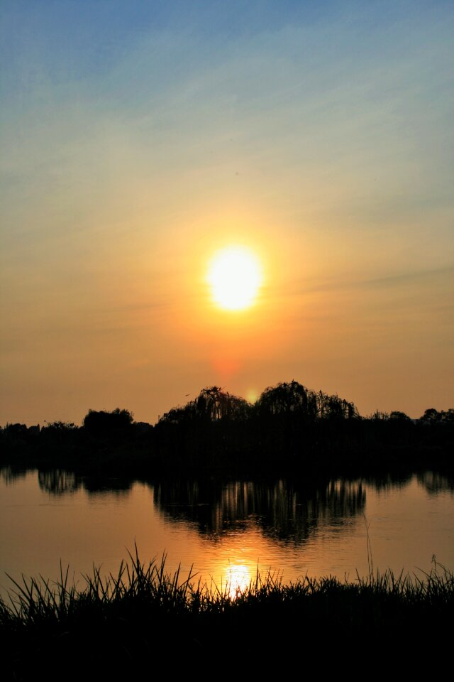 Sunset sun reflection photo