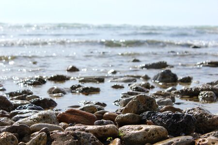 Sea pebbles water photo