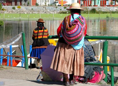Women peruvian inside lake photo
