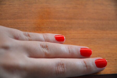 Hands nails the nail