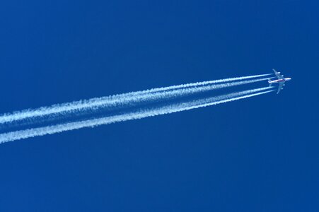 Airliner condensation trails air corridor photo