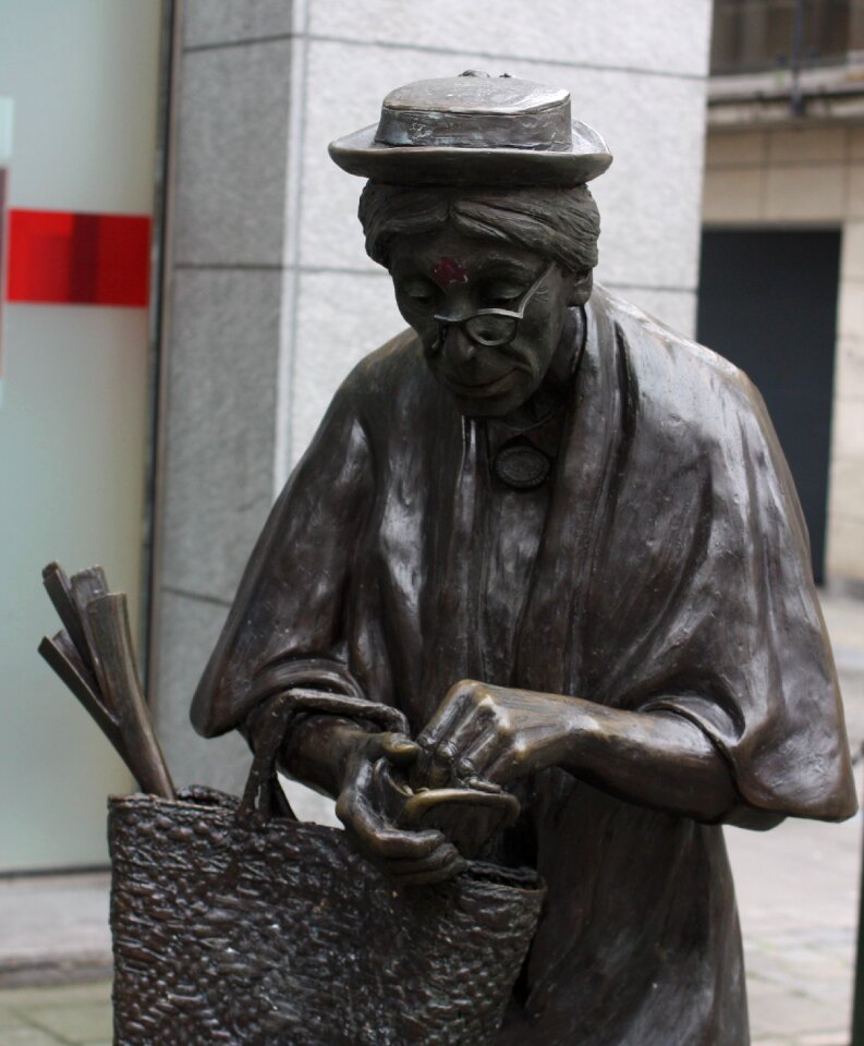 Sculpture brussels an elderly woman