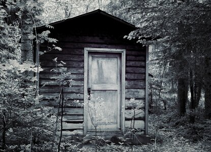 Log cabin rest house black and white photo