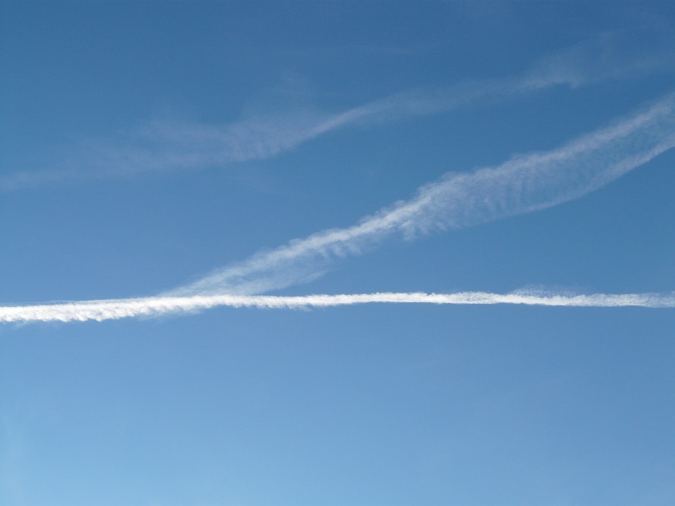 Blue aircraft flying