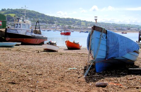 Fishing boat row boat shore photo