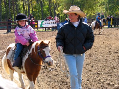 Woman cowboy pony riding photo