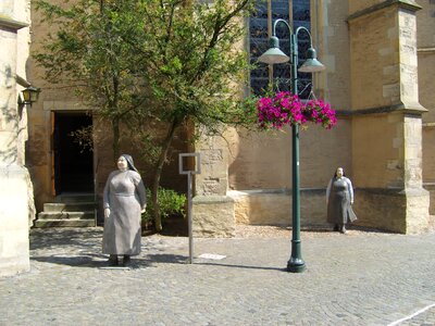 Concrete sculpture nuns church photo