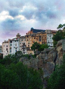 Rocks and city old town hanging houses photo