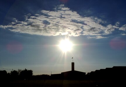Sunrise against light clouds in the sun