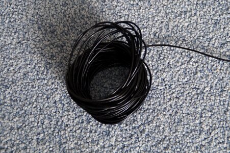 Black rolled up coiled