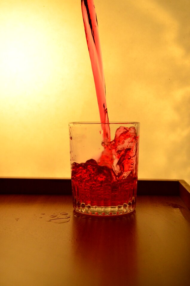 Red pouring alcohol