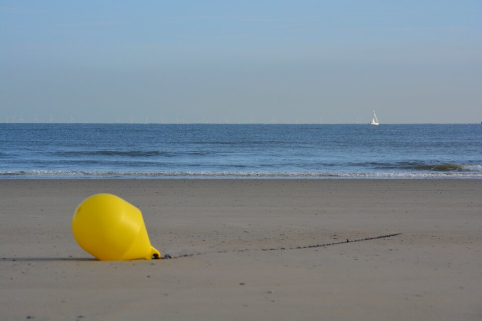Sea beach yellow buoy