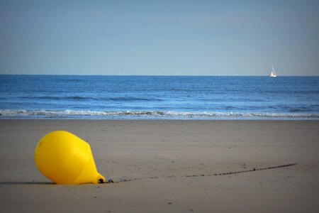 Beach sea yellow buoy photo