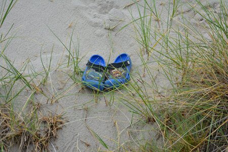 Shoes sand coast